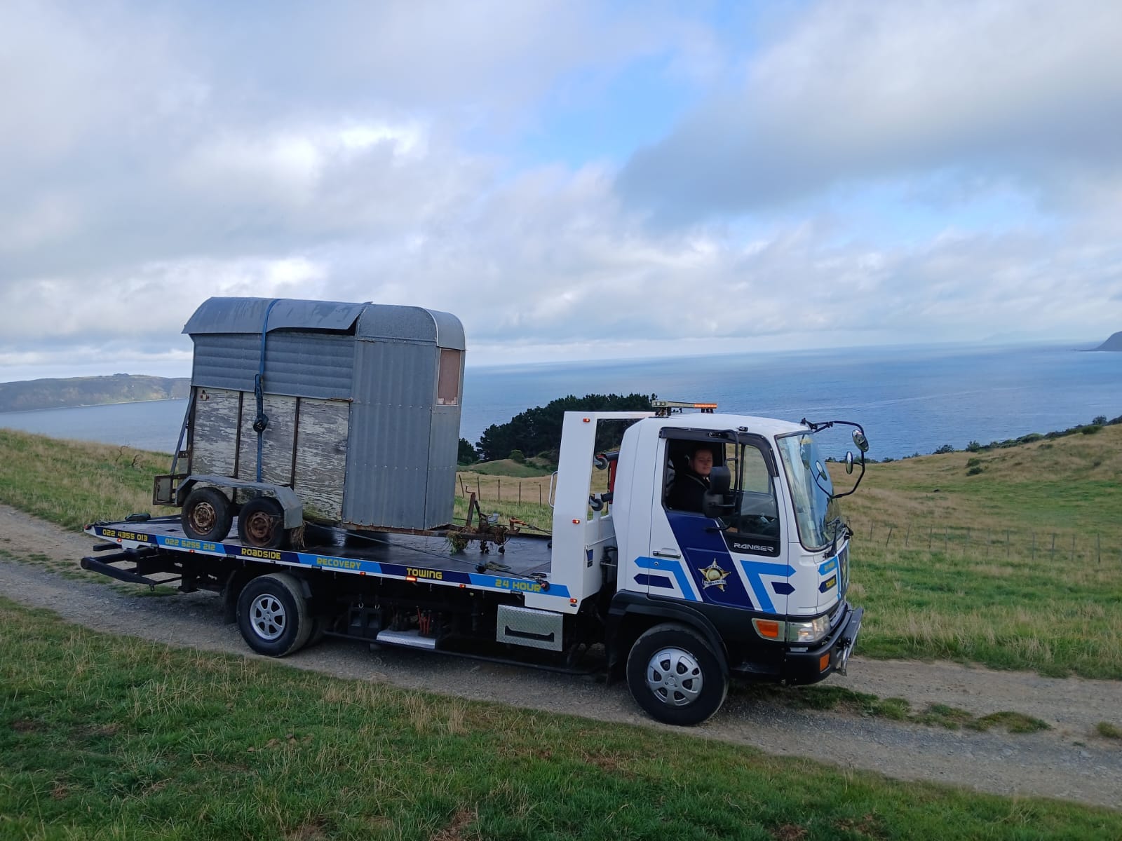 Road Marshall truck towing a horse float along the Wellington coast