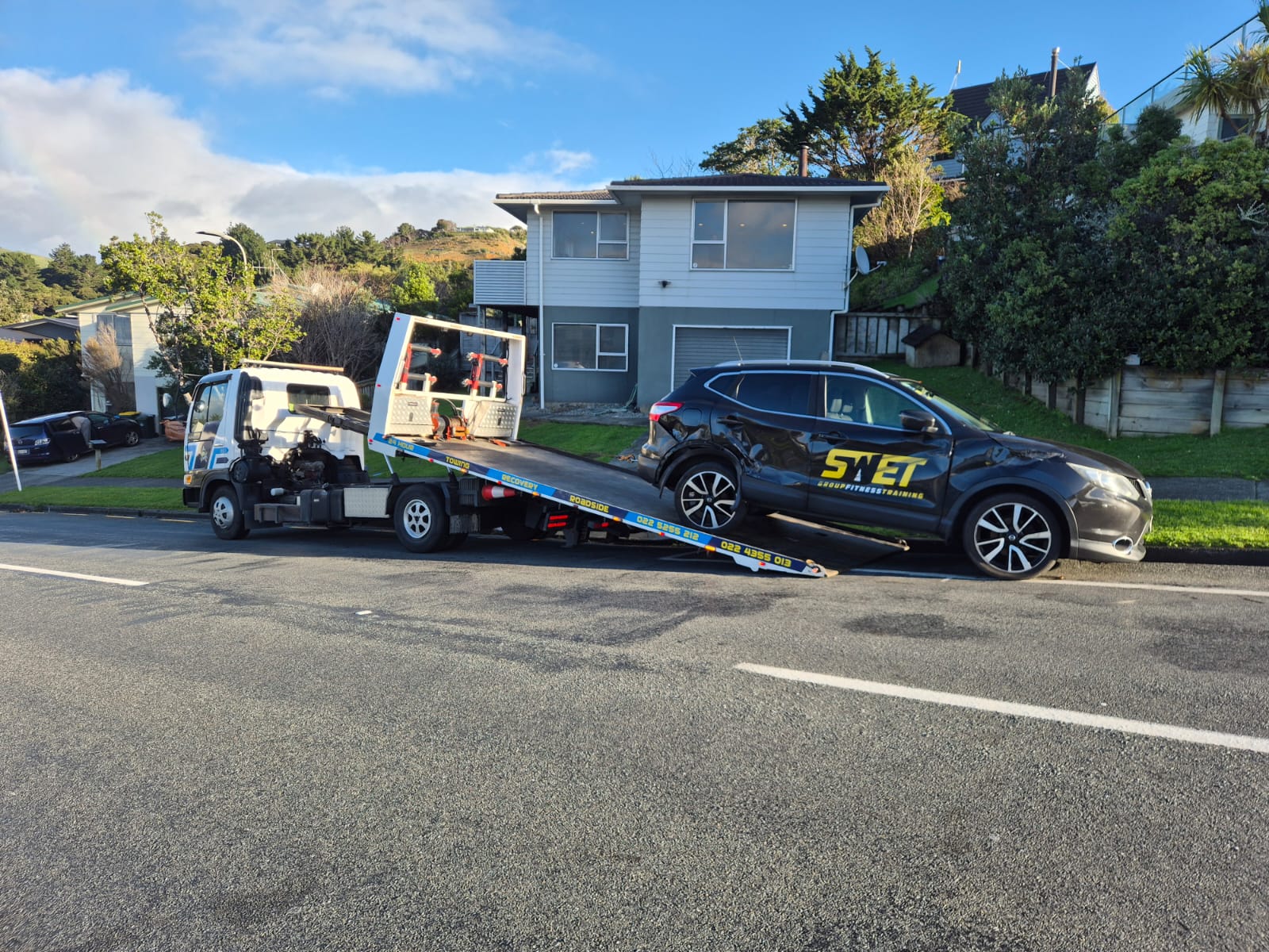 Road Marshall truck recovering a crashed Nissan Qashqai