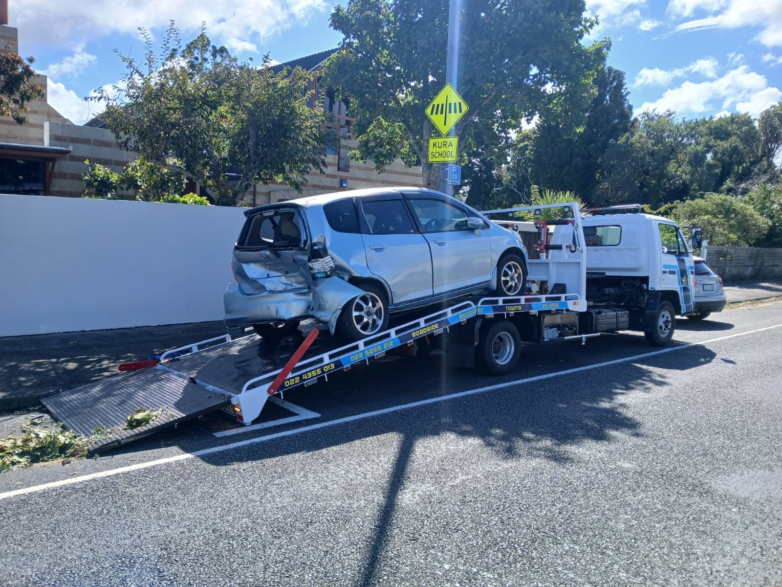 Road Marshall truck transporting a classic pickup truck